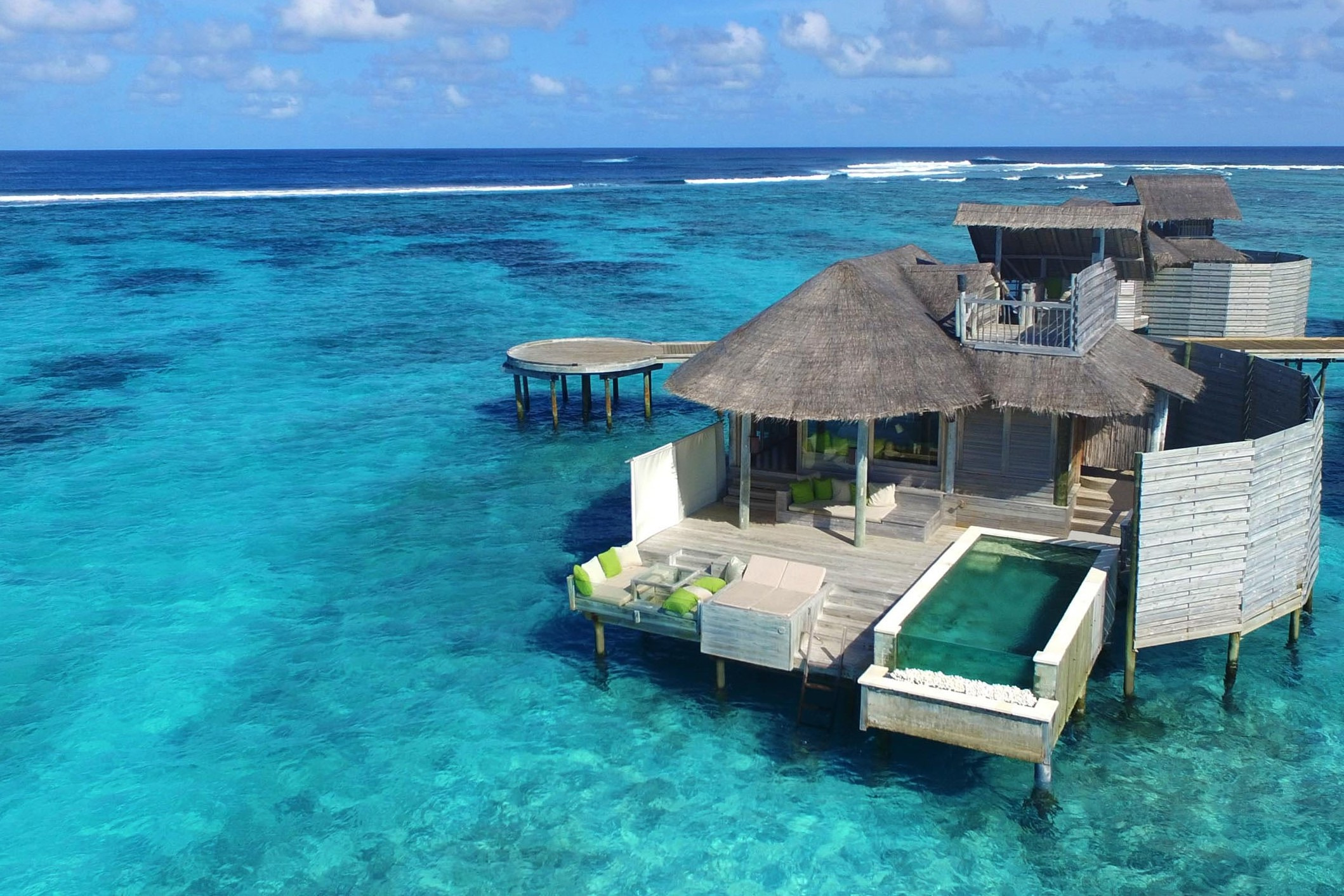 Redeem IHG Rewards points for an overwater villa at Six Senses in the Maldives.